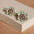 Silphony aqua blossom earrings on white reflective background