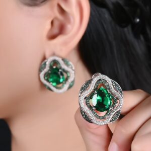 Close-up view of a Rhea earring, showcasing its detailed craftsmanship, sparkling gemstones, and elegant design