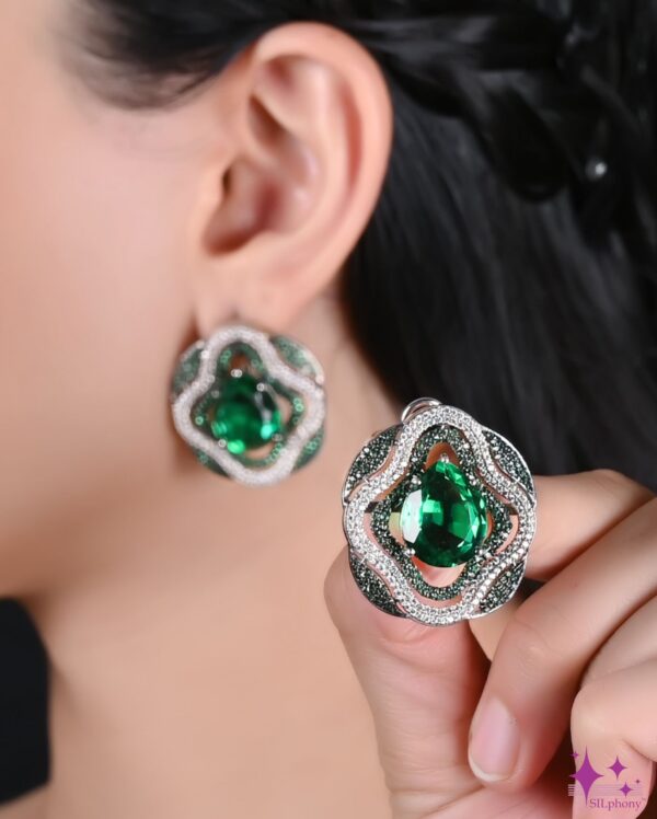 Close-up view of a Rhea earring, showcasing its detailed craftsmanship, sparkling gemstones, and elegant design